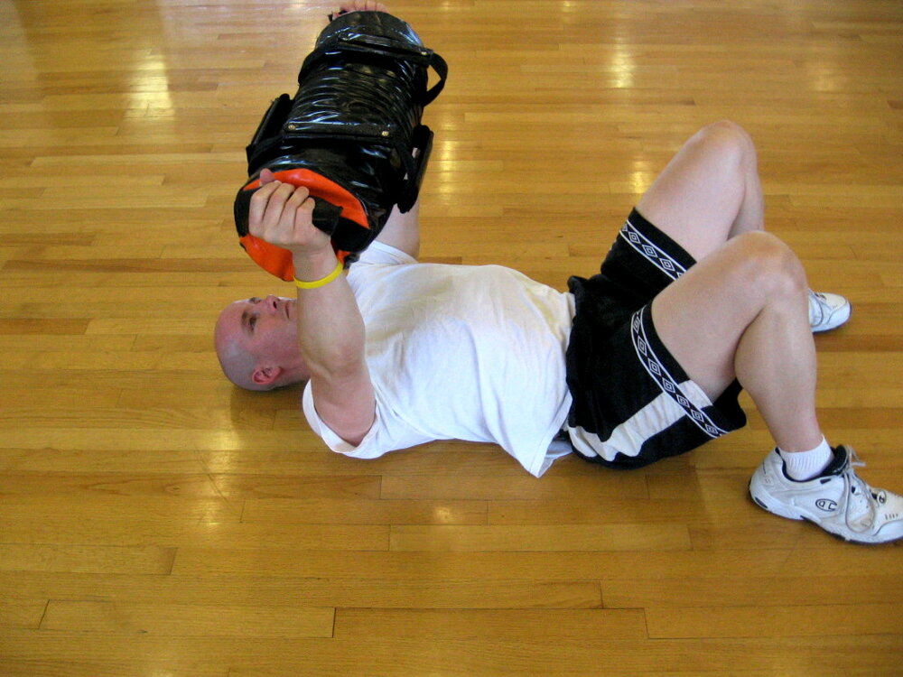 TAKU Doing a Sand-Bag floor press