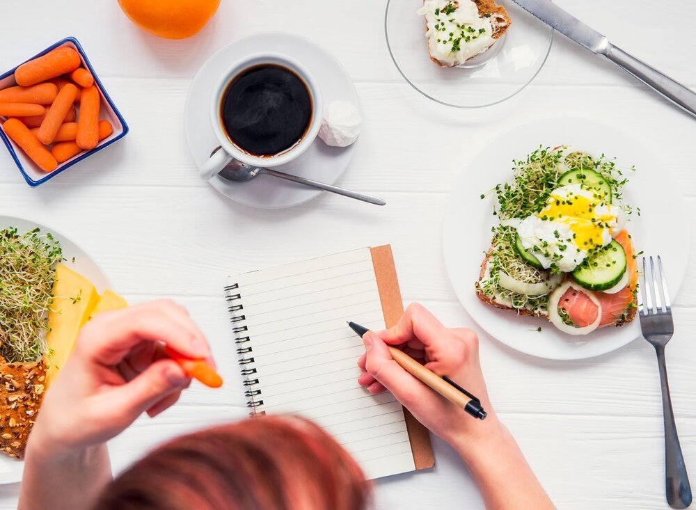 woman-writing-in-food-journal.jpg